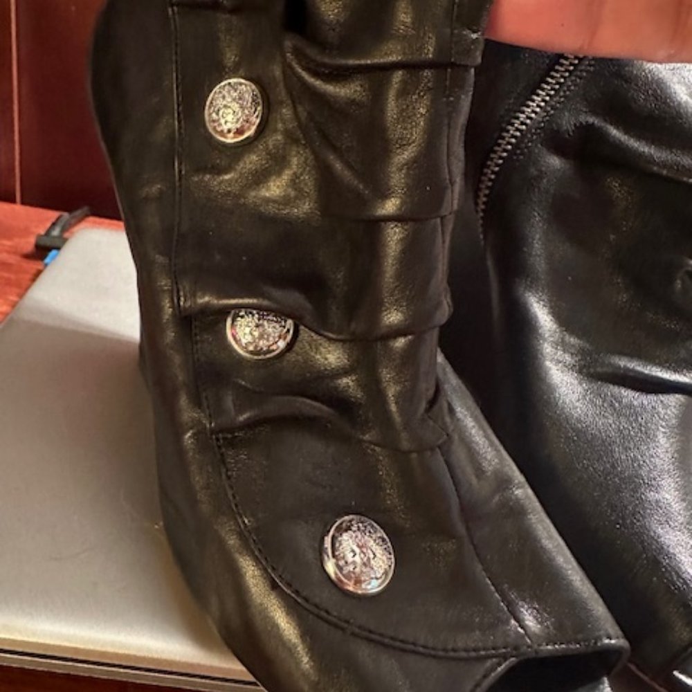 Booties with silver button detailing.